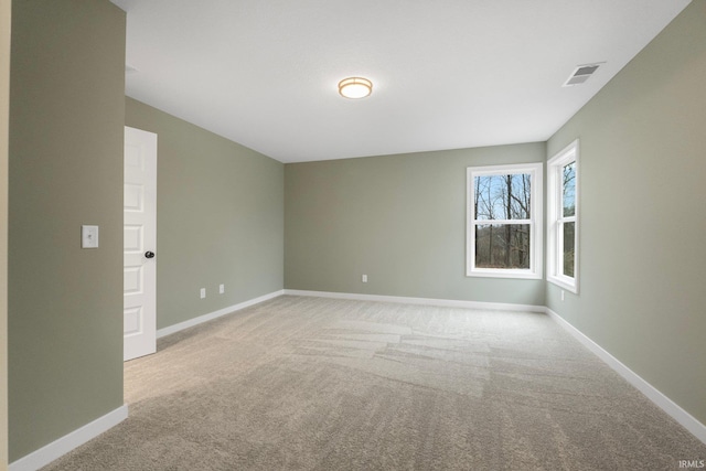 empty room featuring light carpet