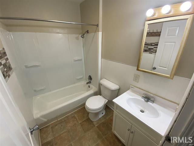 full bathroom featuring vanity,  shower combination, and toilet