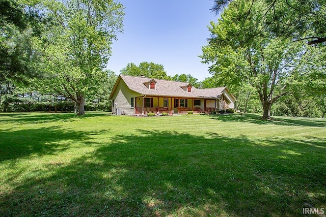 exterior space featuring a front lawn and a porch