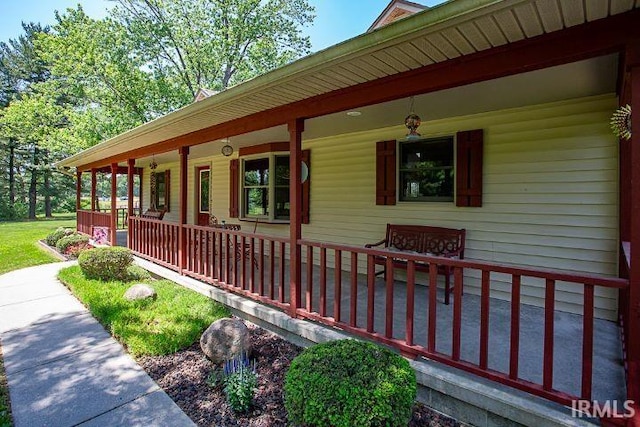 view of side of property with a porch