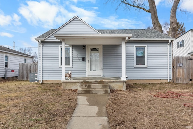 bungalow featuring central AC unit