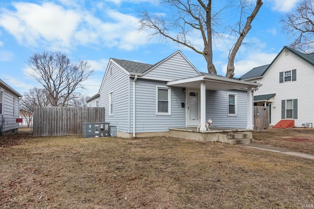 bungalow-style home featuring a front lawn