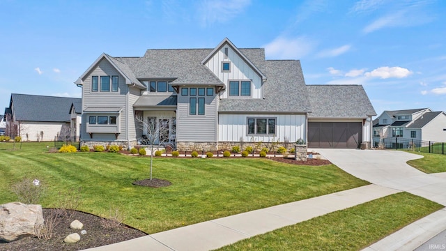 view of front facade with a garage and a front lawn