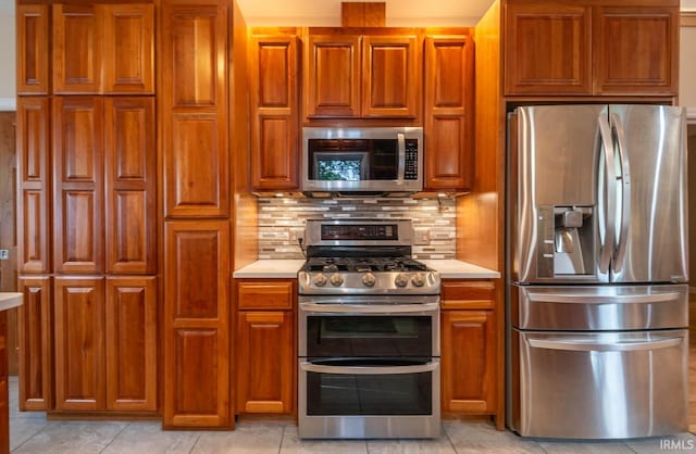 kitchen featuring appliances with stainless steel finishes and backsplash