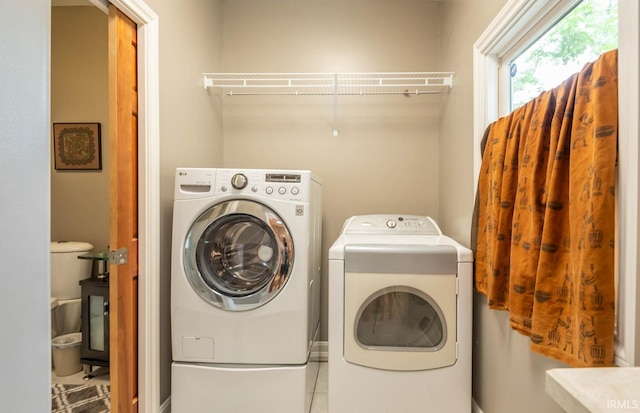 laundry room featuring separate washer and dryer