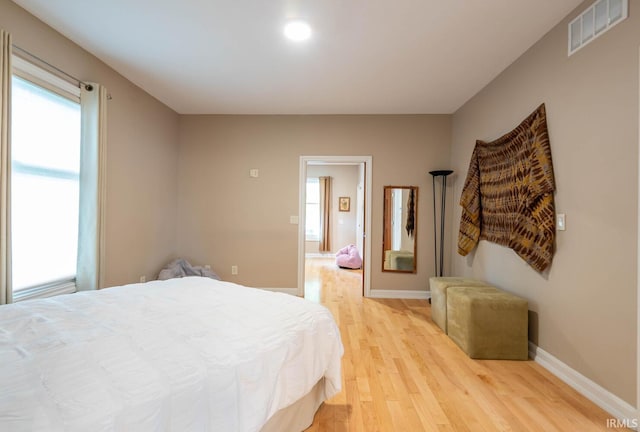 bedroom with light hardwood / wood-style flooring