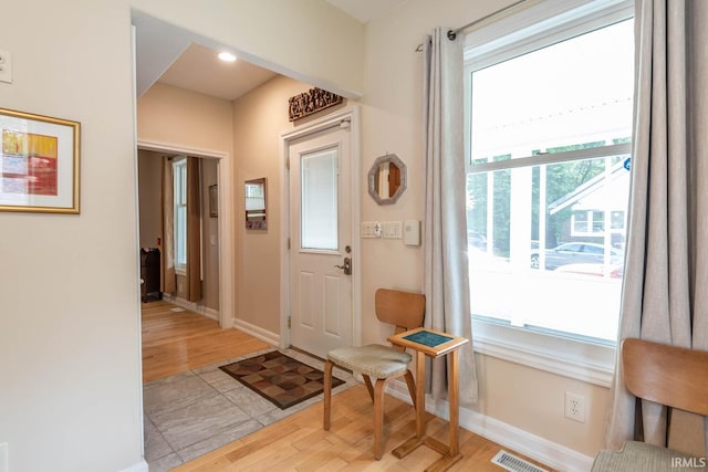 foyer with light hardwood / wood-style flooring