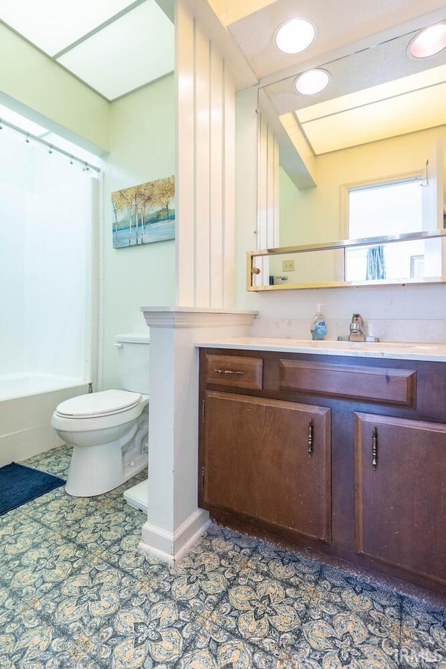 full bathroom with vanity, shower / tub combination, tile patterned floors, and toilet