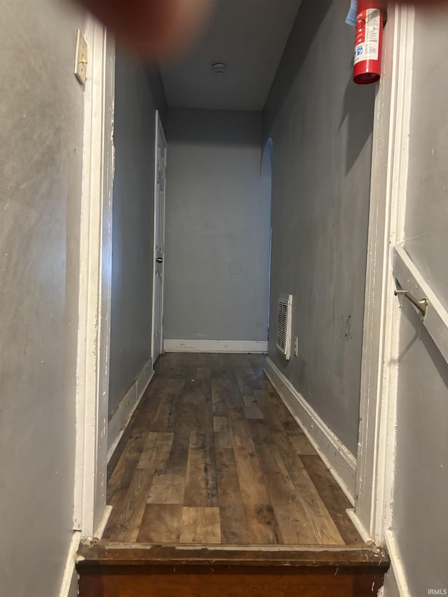 hallway featuring dark wood-type flooring