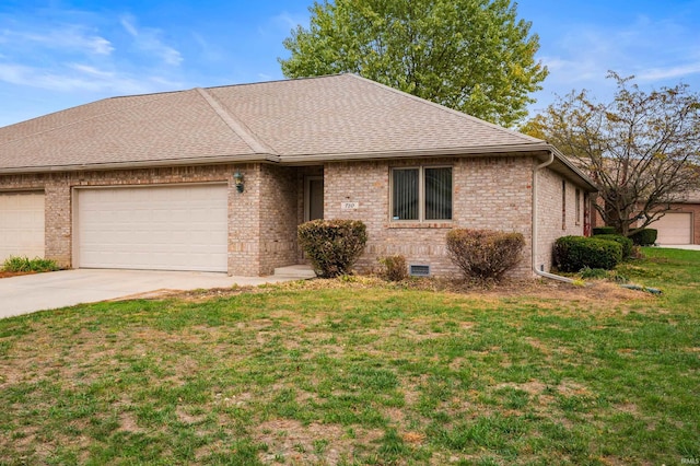 ranch-style home with a garage and a front yard