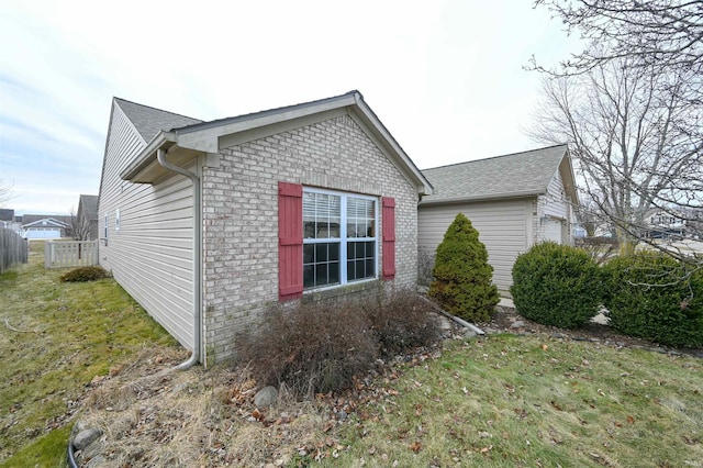 view of home's exterior with a lawn