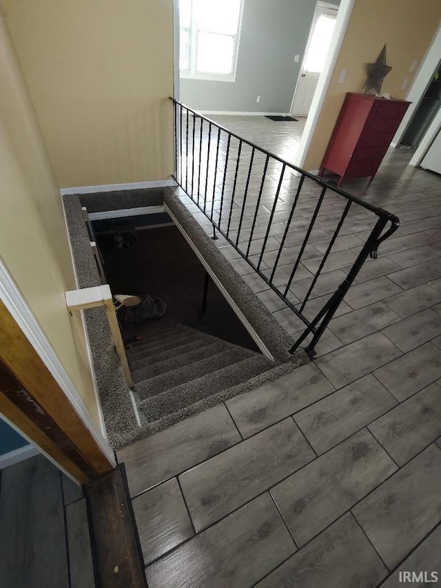 stairs featuring wood-type flooring