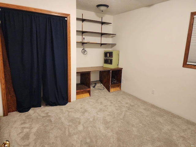 bedroom with light colored carpet