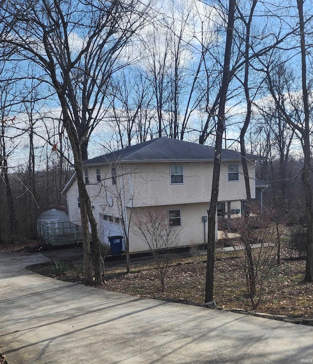 view of property exterior with a garage