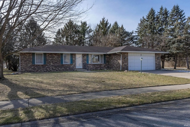 ranch-style house featuring a garage and a front lawn