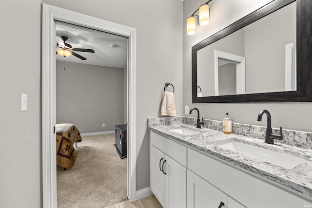 bathroom featuring vanity and ceiling fan