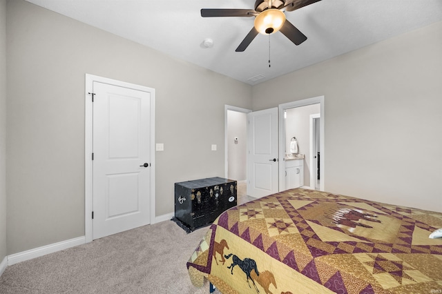 carpeted bedroom featuring ensuite bathroom and ceiling fan