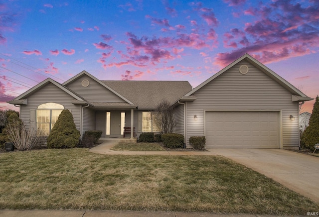 single story home with a garage and a lawn