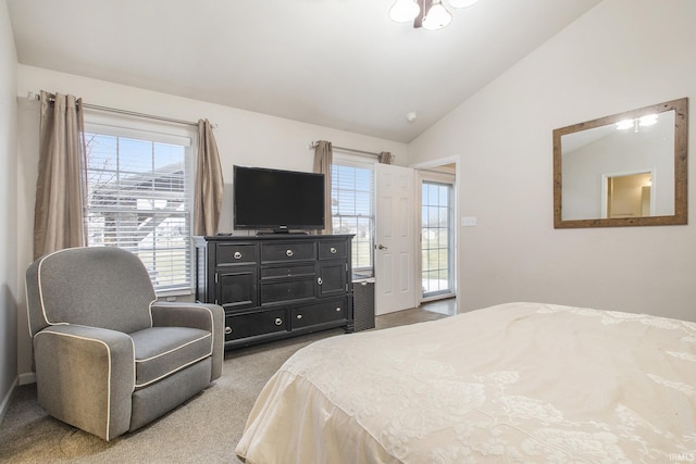 bedroom with light colored carpet and vaulted ceiling