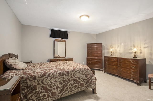 bedroom featuring light colored carpet