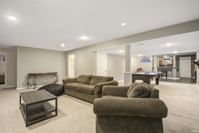 carpeted living room with billiards