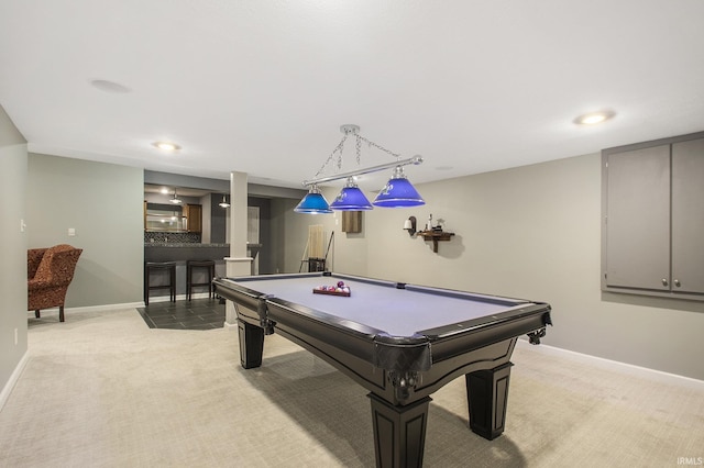 game room featuring pool table, bar, and light carpet