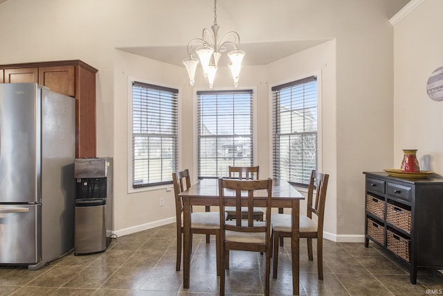 tiled dining space featuring a notable chandelier