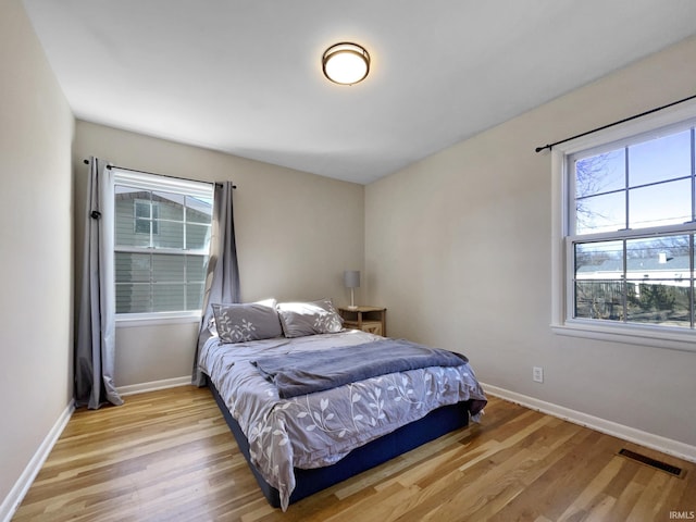 bedroom with light wood-type flooring