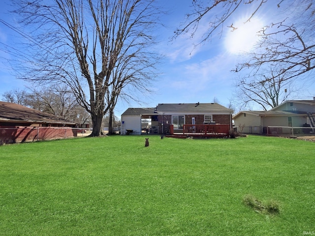 view of yard with a wooden deck