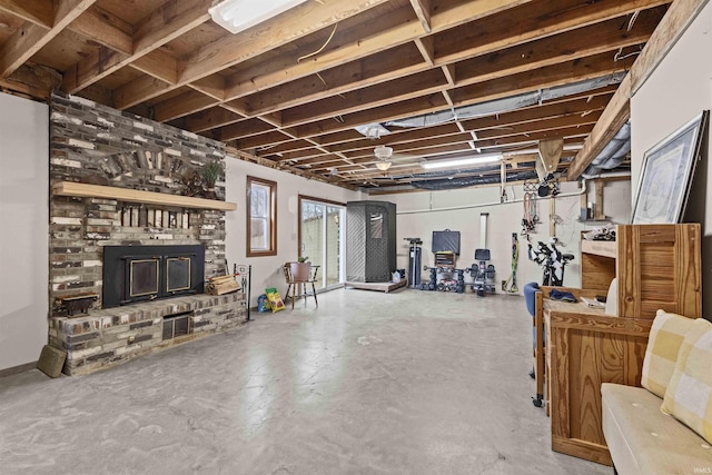 basement featuring a brick fireplace