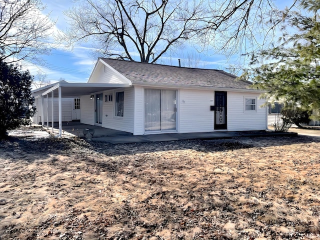 back of property with a patio area