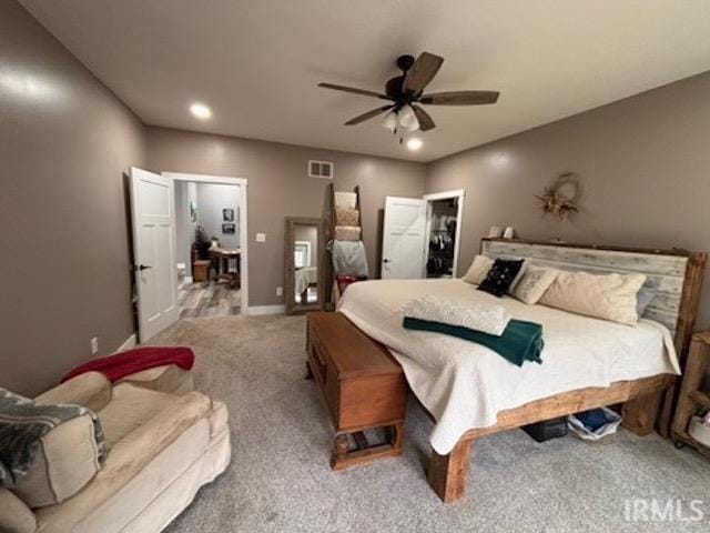 bedroom with ceiling fan and carpet flooring