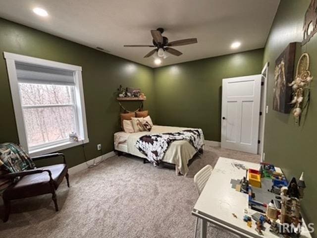 bedroom with ceiling fan and carpet floors