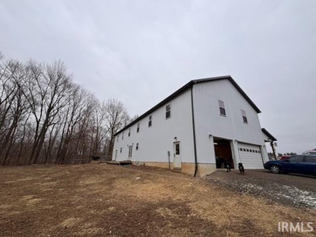 view of property exterior featuring a garage