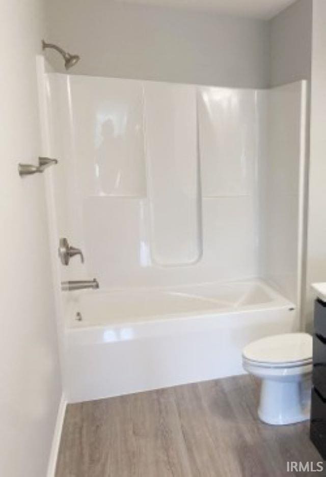 full bathroom with vanity, wood-type flooring, bathtub / shower combination, and toilet