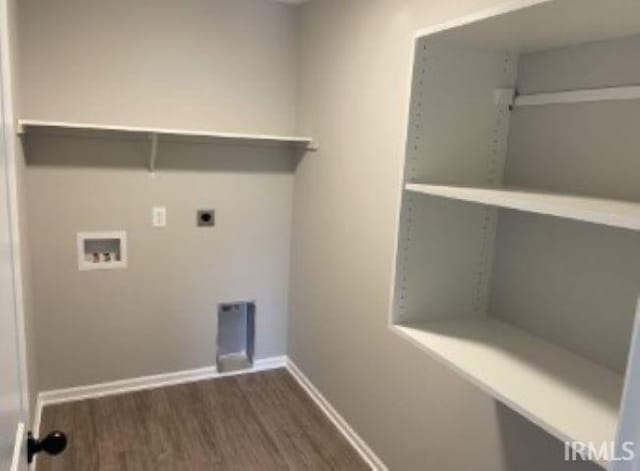 washroom with electric dryer hookup, washer hookup, and dark hardwood / wood-style flooring