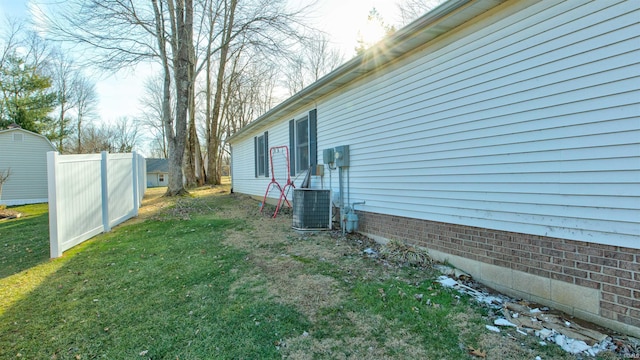 view of yard with central air condition unit