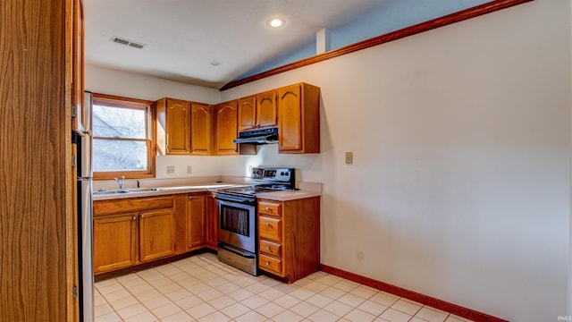 kitchen featuring light tile patterned flooring, appliances with stainless steel finishes, and sink