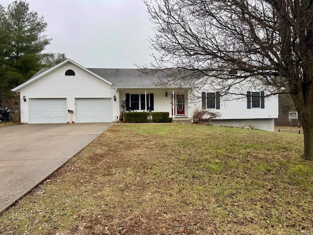 ranch-style house featuring a garage and a front yard