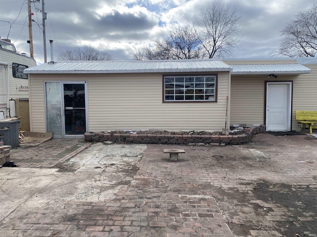 back of property featuring a patio