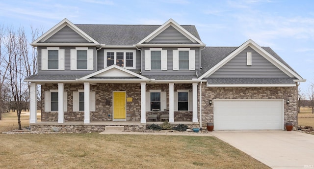 craftsman-style house with a porch, a garage, and a front lawn