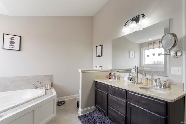 bathroom with vanity, tile patterned floors, and a bathtub