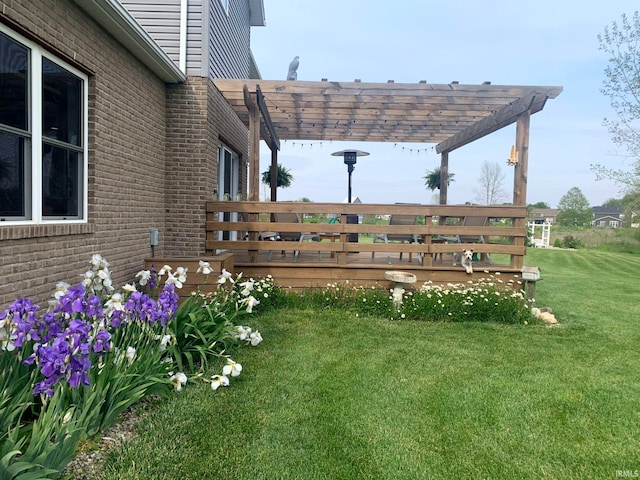 view of yard featuring a pergola and a deck