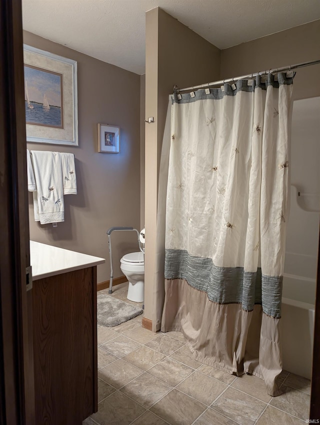 full bathroom featuring vanity, shower / bathtub combination with curtain, a textured ceiling, and toilet
