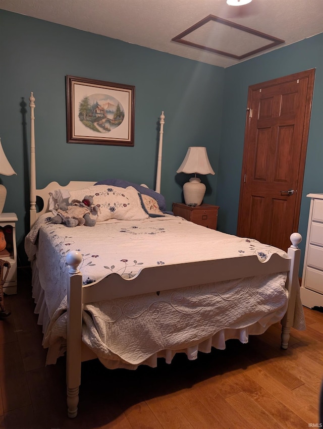 bedroom with hardwood / wood-style floors