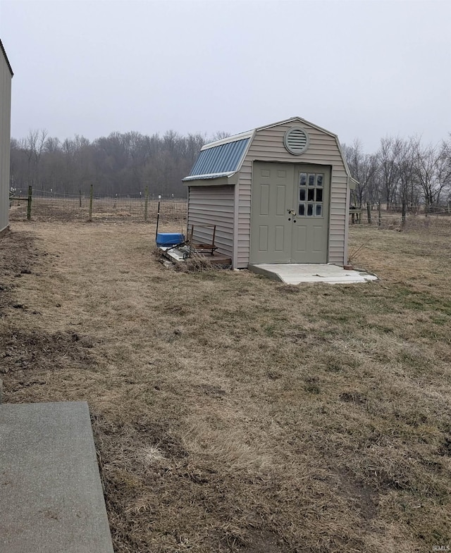 view of outbuilding featuring a lawn