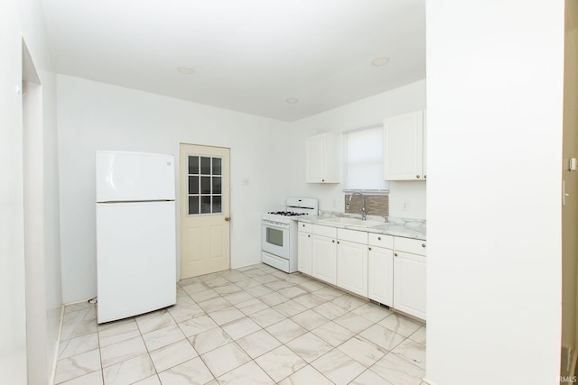 kitchen featuring white cabinetry, white appliances, light stone countertops, and sink