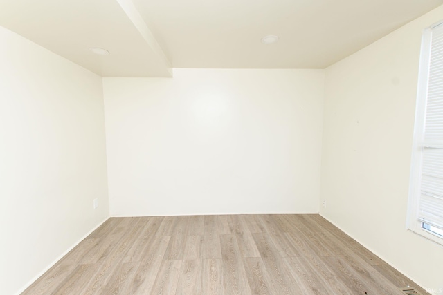 spare room featuring light hardwood / wood-style flooring