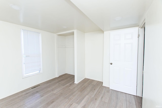 interior space featuring light hardwood / wood-style floors and a closet