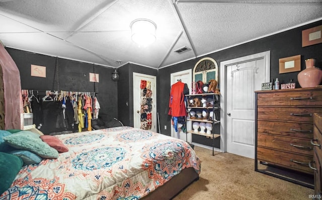 bedroom featuring vaulted ceiling, carpet, and a textured ceiling